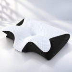 ERGONAX contoured memory foam pillow shown from the front with a recessed center and raised side contours.