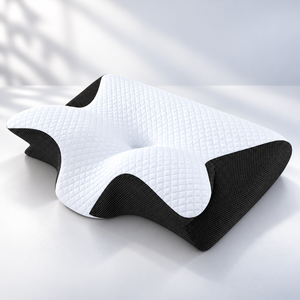ERGONAX contoured memory foam pillow shown from the front with a recessed center and raised side contours.
